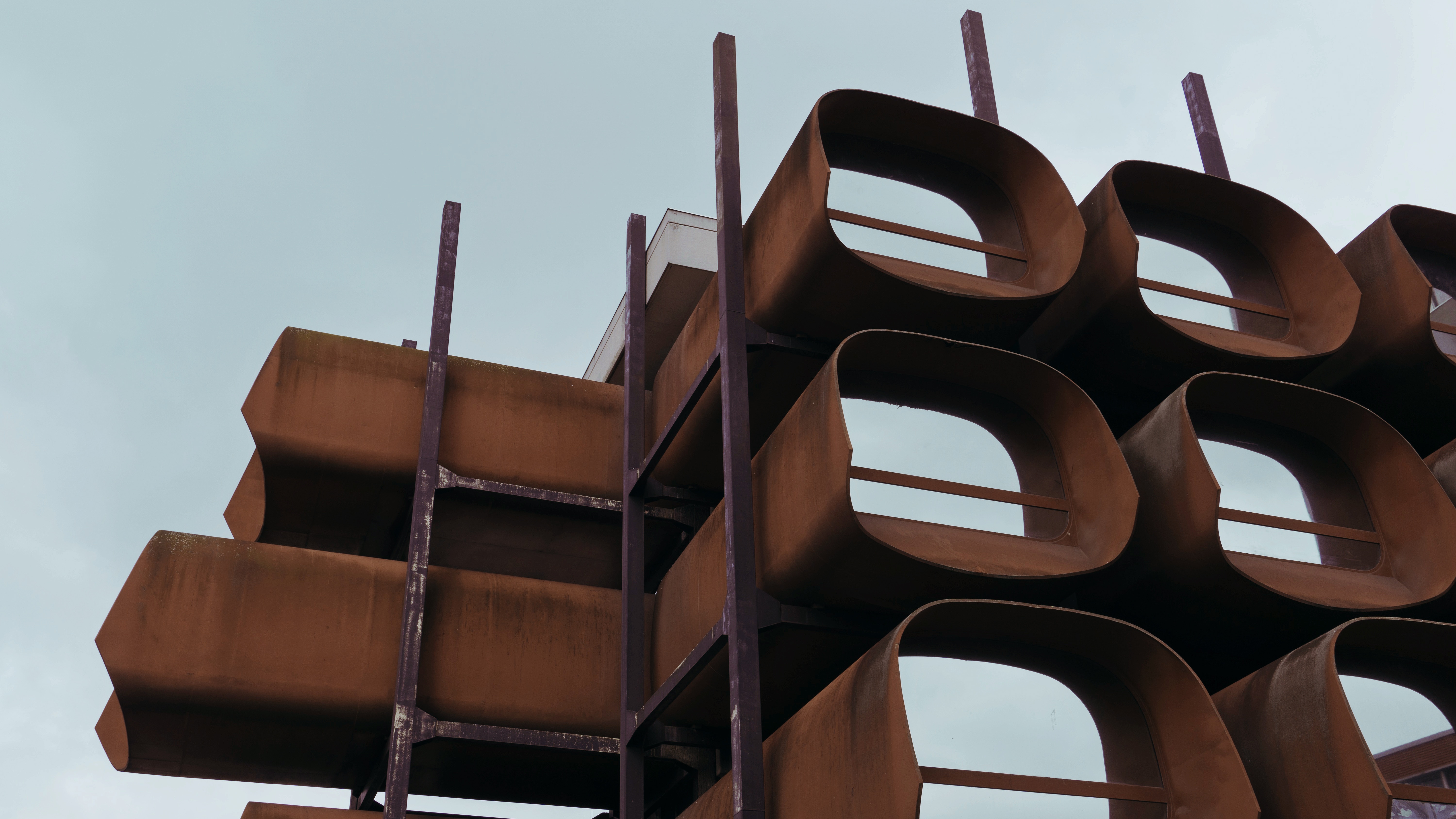Photograph of the rusted, podlike structure of the Conservatory of Montreuil